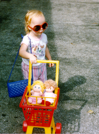 young me with plastic shopping cart