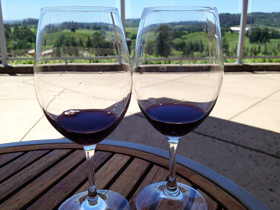 Wine glasses at Russian Hill Estate Winery with vineyard